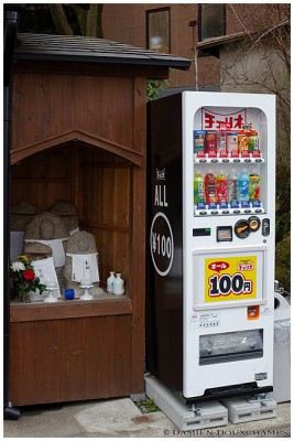 Jizo (stone idols) and vending machine Jizo (stone idols) and vending machine